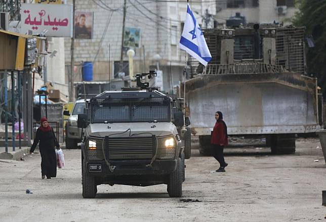 Israeli military vehicles are seen during an Israeli military operation in the West Bank city of Jenin, on Jan. 22, 2025. Israel continued its military operation in Jenin for a second day, killing at least ten people, the military said on Wednesday, as Palestinian sources reported that Israeli troops also injured dozens. (Photo by Nidal Eshtayeh/Xinhua)