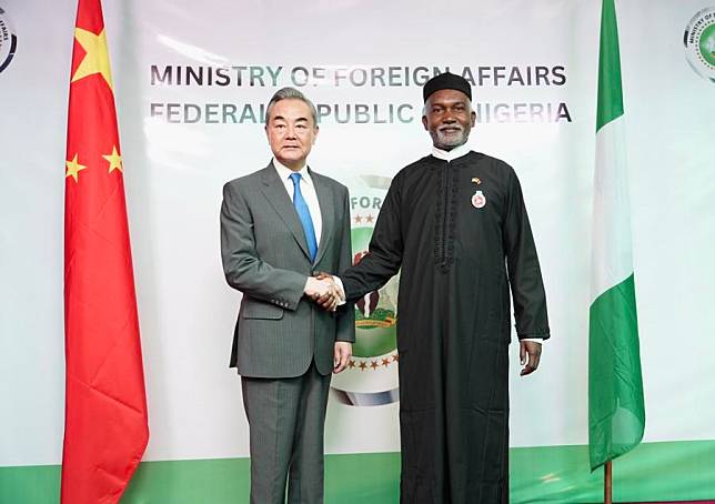 Chinese Foreign Minister Wang Yi (L), also a member of the Political Bureau of the Communist Party of China Central Committee, shakes hands with Nigerian Foreign Minister Yusuf Tuggar during their meeting in Abuja, Nigeria, on Jan. 9, 2025. (Xinhua/Yang Zhe)