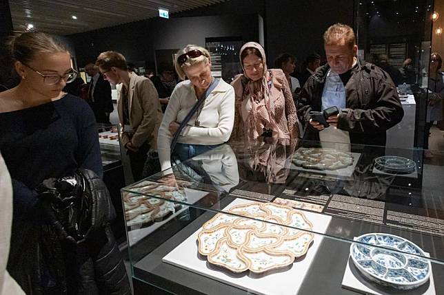 Visitors watch exhibits on display during the &ldquo;Fine Dining: Food Stories of Ancient China&rdquo; exhibition in Budapest, Hungary on Oct. 15, 2024. (Photo by Attila Volgyi/Xinhua)