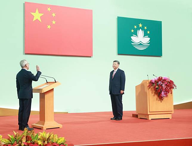 Chinese President Xi Jinping, also general secretary of the Communist Party of China Central Committee and chairman of the Central Military Commission, administers the oath of office to Sam Hou Fai, new chief executive of the Macao Special Administrative Region (SAR), at the Macao East Asian Games Dome in Macao, south China, Dec. 20, 2024. Xi on Friday delivered a speech at a meeting celebrating the 25th anniversary of Macao's return to the motherland and the inaugural ceremony of the sixth-term government of the Macao SAR. (Xinhua/Ju Peng)