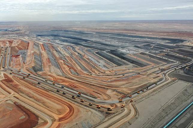 An aerial drone photo taken on Sept. 27, 2024 shows the operation site of the No.1 open-pit coal mine of Xinjiang Hongshaquan Energy Co., Ltd of China Energy Group in northwest China's Xinjiang Uygur Autonomous Region. (Xinhua/Ding Lei)