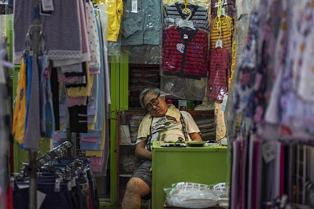 A shop owner at the North Point wet market. The proposal also calls for a rent cut for stall operators. Photo: Roy Issa