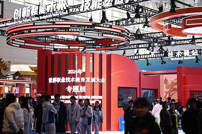 People visit an achievement exhibition during the 2024 World Vocational and Technical Education Development Conference in Tianjin, north China, Nov. 21, 2024. (Xinhua/Li Ran)