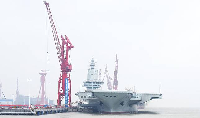 China's third aircraft carrier, the Fujian, docks in east China's Shanghai on April 30, 2024. China's third aircraft carrier, the Fujian, set out for maiden sea trials on Wednesday morning. Since its launch in June 2022, the Fujian has completed its mooring trials, outfitting work and equipment adjustments. It has met the technical requirements for sea trials. (Xinhua/Li Yun)