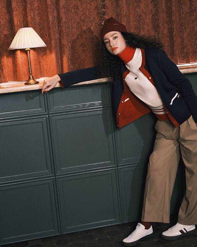 A model in Tommy Hilfiger reversible crewneck cardigan, crewneck short-sleeve sweater and twill blend straight pants (Photo: Tatler Hong Kong/ Karl Lam)