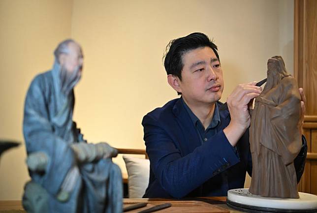 Zhang Yu, the sixth generation inheritor of &ldquo;Clay Figure Zhang,&rdquo; a clay sculpture art, kneads a new figurine at Clay Figure Zhang Art Gallery in north China's Tianjin Municipality, Jan. 20, 2025. &ldquo;Clay Figure Zhang&rdquo; is one of the representatives of clay sculpture art in northern China. In 2006, it was listed in the first batch of national intangible cultural heritage. As the Spring Festival draws near, &ldquo;Clay Figure Zhang&rdquo; in Tianjin has rolled out many festive-themed clay sculptures, as well as various creative cultural products, to better meet the consumption needs. (Xinhua/Sun Fanyue)