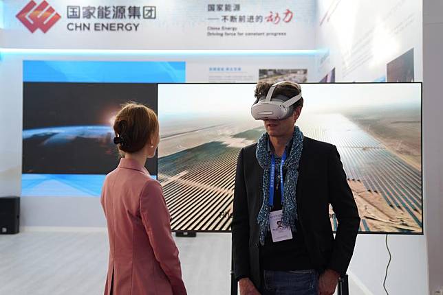 A participant tries VR at the venue of the opening ceremony of the 6th World Media Summit in Urumqi, capital city of northwest China's Xinjiang Uygur Autonomous Region, Oct. 14, 2024. (Xinhua/Liu Mengqi)