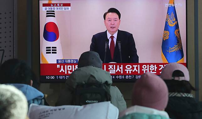 People watch a televised address by South Korean President Yoon Suk-yeol at Seoul Railway Station in Seoul, South Korea, Dec. 12, 2024. (Xinhua/Yao Qilin)