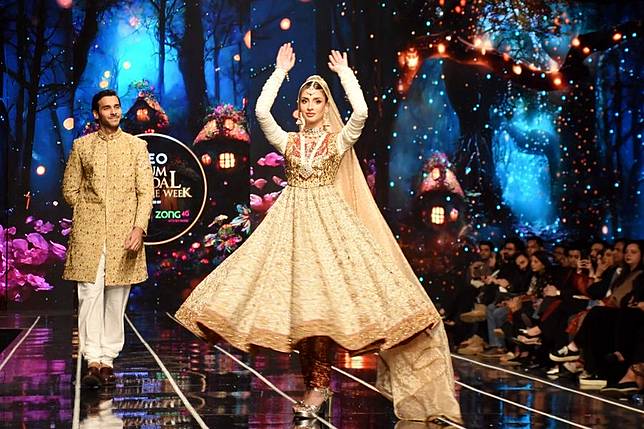 Models present creations on the first day of the Neo HUM Bridal Couture Week in Lahore, Pakistan on Dec. 20, 2024. (Photo by Sajjad/Xinhua)