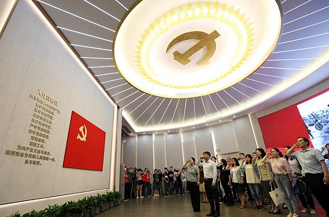 Members of the Communist Party of China (CPC) review the Party admission oath at the memorial of the first National Congress of the CPC in Shanghai, June 3, 2021. (Xinhua/Liu Ying)