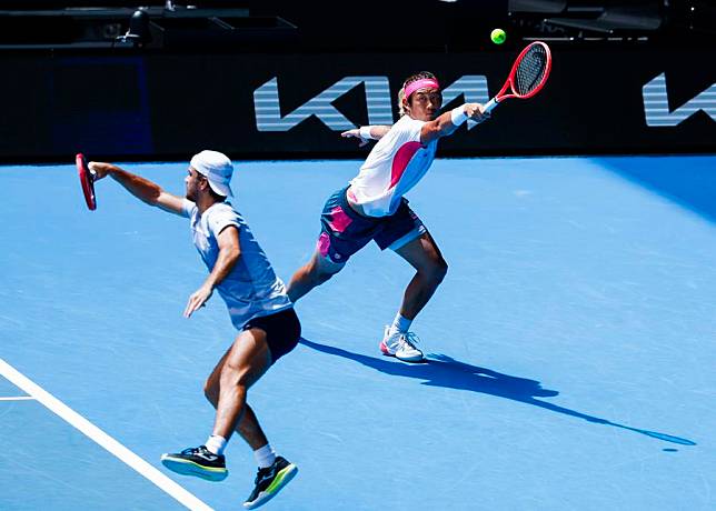 Zhang Zhizhen &reg; and Tomas Machac compete during the men's doubles third round match against Hugo Nys and Edouard Roger-Vasselin at Australian Open tennis tournament in Melbourne, Australia, Jan. 20, 2025. (Photo by Chu Chen/Xinhua)