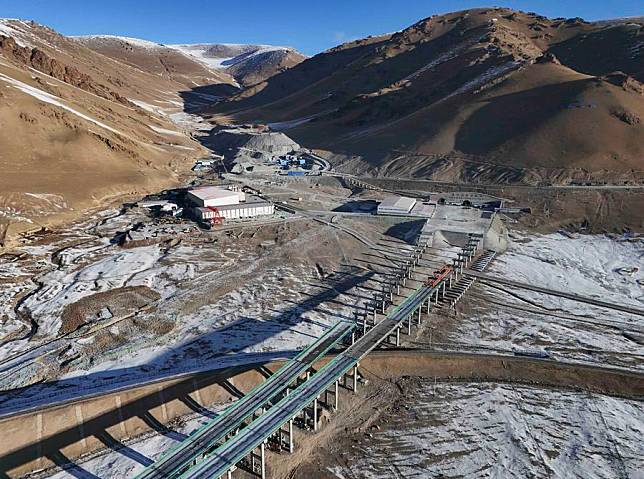 A drone photo taken on Dec. 25, 2024 shows the exit of the Tianshan Shengli Tunnel in Hejing County of Mongolian Autonomous Prefecture of Bayingolin, northwest China's Xinjiang Uygur Autonomous Region. (Xinhua/Hu Huhu)