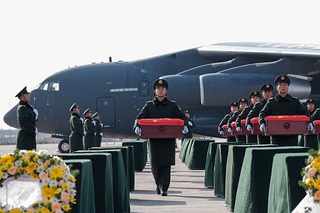 Soldiers escort coffins containing the remains of Chinese People's Volunteers (CPV) martyrs at the Taoxian international airport in Shenyang, northeast China's Liaoning Province, Nov. 28, 2024. The remains of 43 CPV soldiers who lost their lives during the War to Resist U.S. Aggression and Aid Korea (1950-1953) were returned to China on Thursday from the Republic of Korea (ROK). (Xinhua/Li Jie)