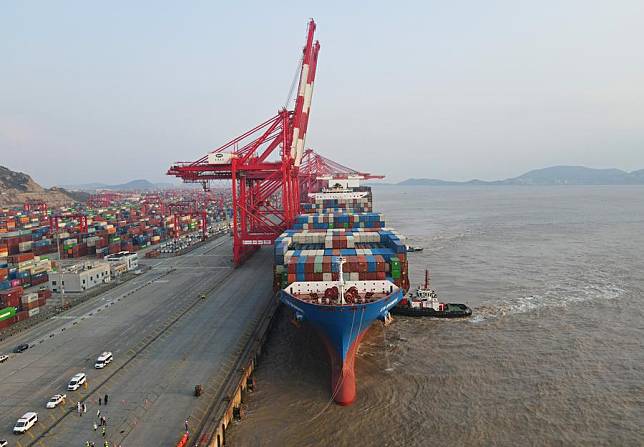 An aerial drone photo shows the &ldquo;Xin Shanghai,&rdquo; a vessel operated by China COSCO Shipping Corporation Limited, berthed at Yangshan Port, east China's Shanghai, Dec. 18, 2024. (Xinhua/Fang Zhe)