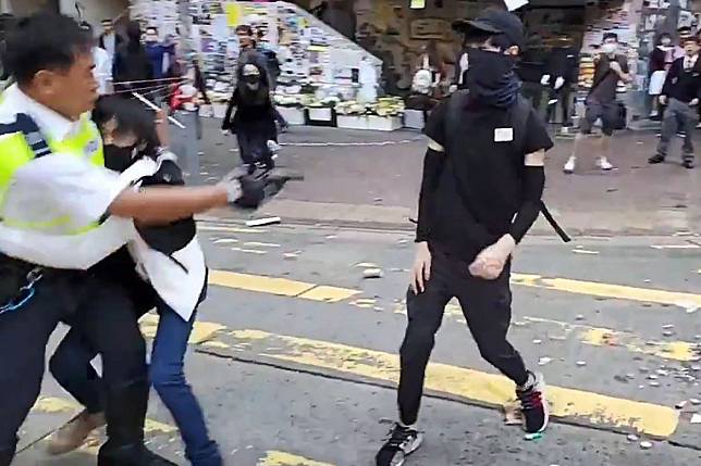 A video grab of the incident showing the moment before a protester approaching an officer is shot. Photo: AFP/ Cupid News