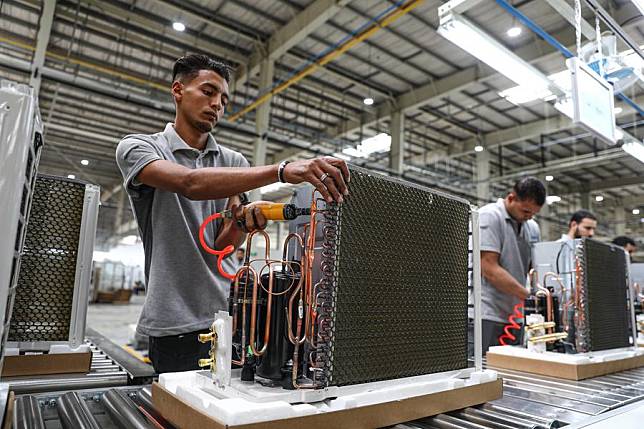 Laborers work on an air-conditioner production line at a factory of the Haier Egypt Ecological Park in the 10th of Ramadan City, Sharqia Province, Egypt, on May 1, 2024. (Xinhua/Ahmed Gomaa)