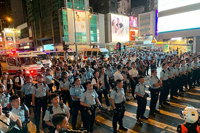 Confrontation outside the Bank Centre in Mong Kok on 7 July 2019 as protesters marching from Tsim Sha Tsui through Nathan Road arrive at Mong Kok. Photo: SCMP/Dickson Lee