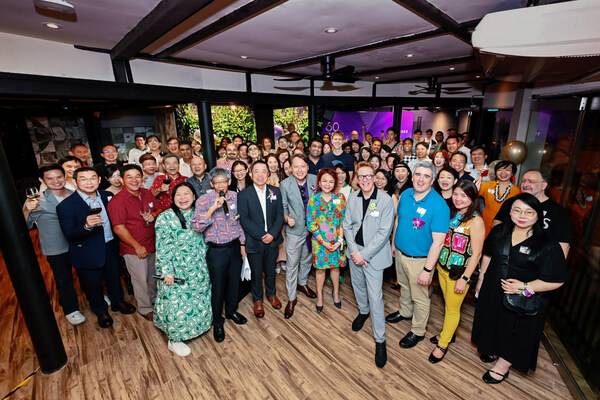 Esteemed hosts and distinguished guests attending the 60th anniversary AMBS cocktail reception at The Villa, Singapore Botanic Gardens.