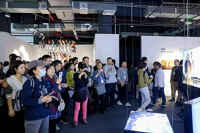 People visit the ninth Jimei x Arles International Photo Festival in Xiamen, east China's Fujian Province, Dec. 15, 2023. (Xinhua)