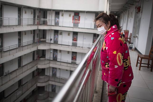 A recovered coronavirus patient waits to leave a rehabilitation centre in Wuhan, central China, after completing a 14-day quarantine under medical observation. Photo: Xinhua