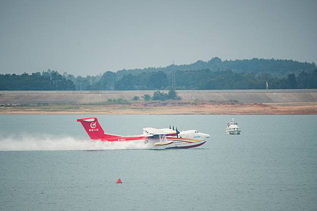 An AG600M firefighting aircraft gathers water during a gathering and dropping water test in Jingmen, central China's Hubei Province, Sept. 27, 2022. (Xinhua/Wu Zhizun)