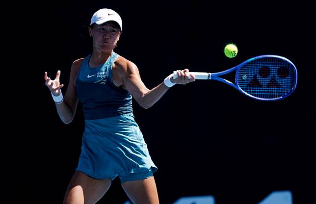 Wang Xiyu hits a return during the women's singles first round match against Julia Grabher of Austria at the Australian Open tennis tournament in Melbourne, Australia, Jan. 14, 2025. (Xinhua/Ma Ping)