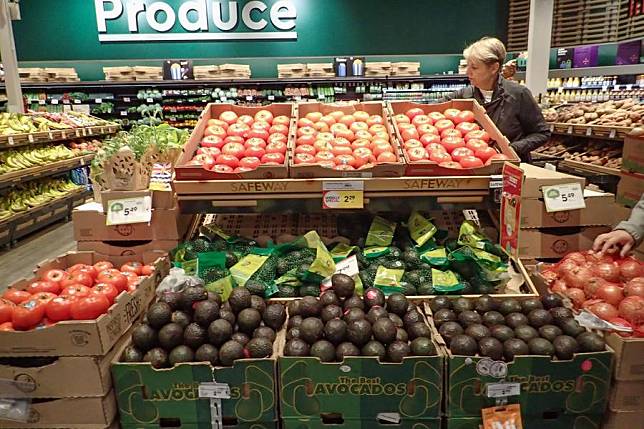 A customer shops for groceries at a supermarket in Vancouver, British Columbia, Canada, on May 21, 2024. (Photo by Liang Sen/Xinhua)