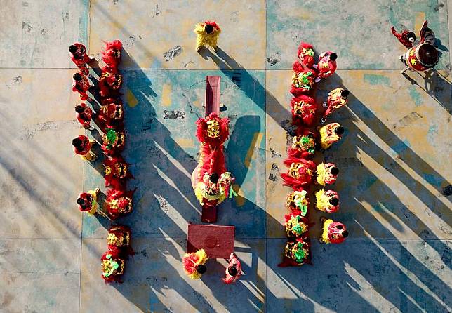 In this aerial drone photo, trainees practice lion dance at a training base in Cangxian County, north China's Hebei Province, Dec. 20, 2024. (Xinhua/Mu Yu)