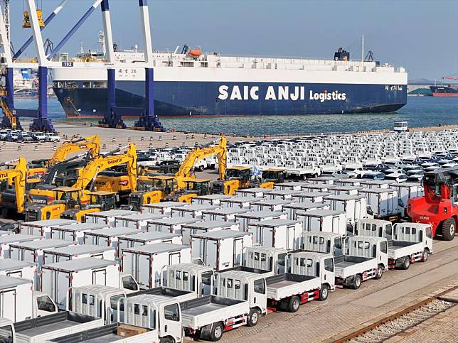 An aerial drone photo shows vehicles to be exported at Yantai Port in east China's Shandong Province, Jan. 2, 2025. (Photo by Tang Ke/Xinhua)