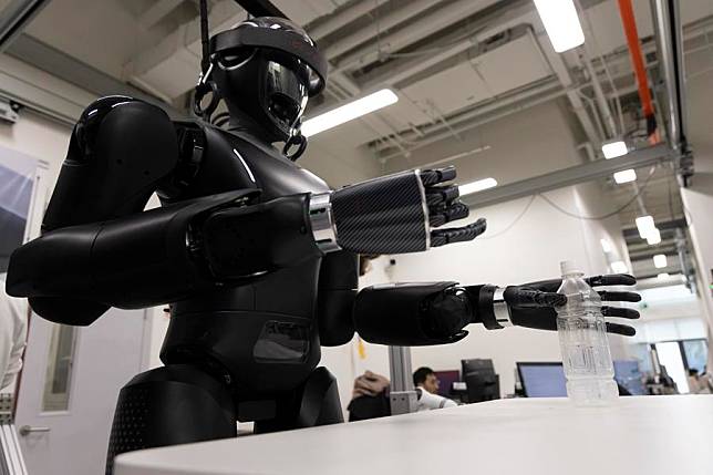 Researchers adjust &ldquo;CASBOT 01&rdquo; at a laboratory in Beijing, capital of China, Nov. 12, 2024. (Xinhua/Jin Liwang)