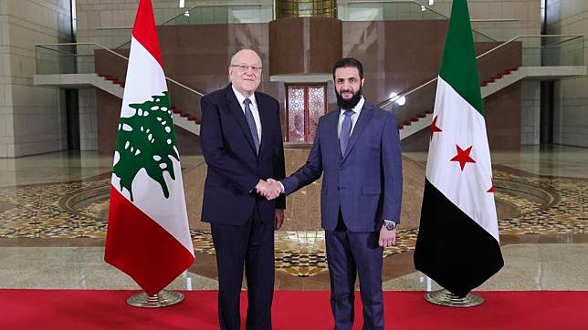 Lebanon's caretaker Prime Minister Najib Mikati (L) shakes hands with Ahmed al-Sharaa, Syria's de facto leader, during a meeting in Damascus, Syria, on Jan. 11, 2024. (Syria's interim Foreign MinistryXinhua)