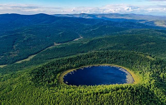 An aerial drone photo taken on Aug. 31, 2023 shows the scenery of Arxan Tianchi (Heavenly Lake) in the Arxan National Forest Park, north China's Inner Mongolia Autonomous Region. (Xinhua/Lian Zhen)