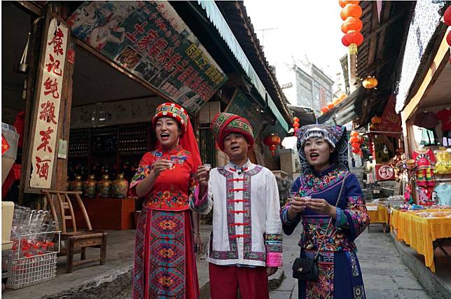 Wu Xiao, the mayor of Furong town in Hunan province, wore traditional clothes to market his town’s touristic attractions.