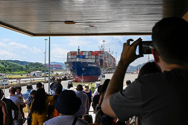 Visitors watch a cargo vessel sailing on the Panama Canal near Panama City, Panama, Aug. 28, 2024. (Xinhua/Li Muzi)