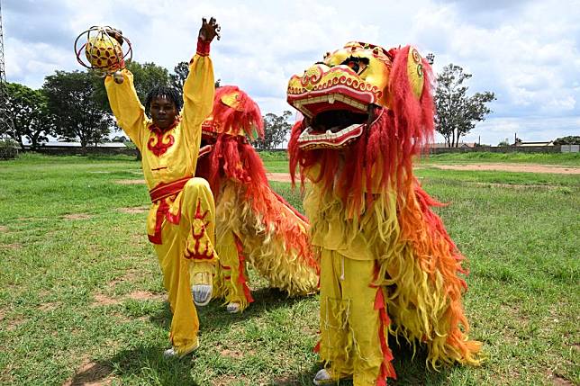 Members of Blackstar Acrobatics practice the Chinese lion dance in Harare, Zimbabwe, on Jan. 14, 2025. (Xinhua/Xu Zheng)