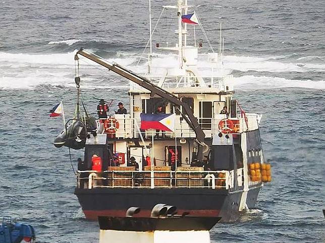 This photo provided by the CCG shows a motorboat being released from a Philippine vessel in waters near Tiexian Jiao of China's Nansha Qundao on Jan. 24, 2025. (Xinhua)