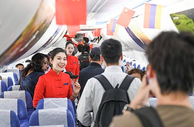 Passengers board flight CZ5091 of China Southern Airlines, which is bound for Yerevan of Armenia, at Urumqi Diwopu International Airport in Urumqi, northwest China's Xinjiang Uygur Autonomous Region, Sept. 3, 2024. (Xinhua/Wang Fei)