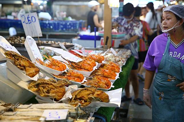 A vendor is seen at the Thonburi Market on the Thonburi side of Bangkok, Thailand, June 22, 2024. (Xinhua/Sun Weitong)
