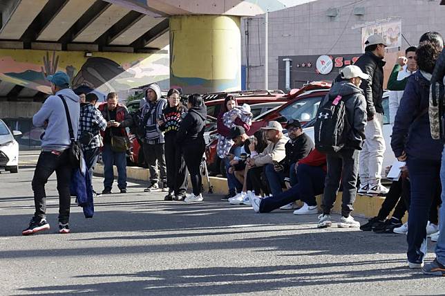 Migrants wait at the Chaparral checkpoint in Tijuana, Mexico, Jan. 20, 2025. Minutes after U.S. President Donald Trump took office, the U.S. Customs and Border Protection (CBP) announced it has canceled all scheduled appointments for immigration and border processing. (Photo by Joebeth Terriquez/Xinhua)