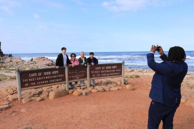 Tourists take photos at the Cape of Good Hope in Cape Town, South Africa, Aug. 12, 2023. (Xinhua/Dong Jianghui)