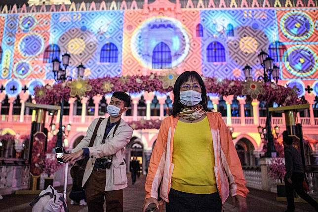 The Macau government has rolled out a scheme to give residents and workers of the casino hub 10 face masks every 10 days for 8 patacas (US$1). Photo: AFP