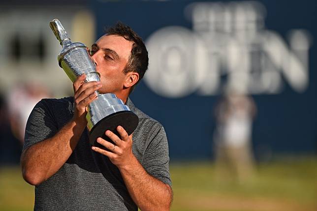 Italy's Francesco Molinari kisses the trophy after winning the 2018 British Open at Carnoustie. Photo: AFP