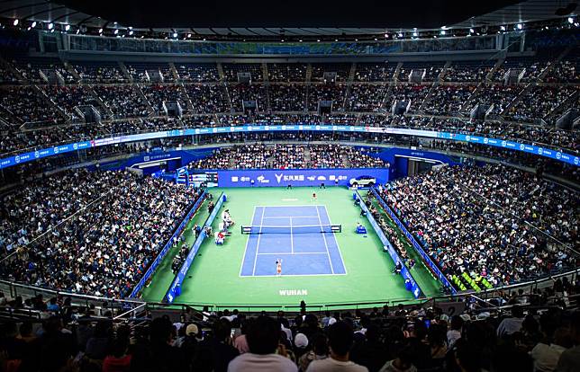 Spectators watch the round of 32 match between Zheng Qinwen of China and Jaqueline Cristian of Romania at the 2024 Wuhan Open tennis tournament in Wuhan, capital of central China's Hubei Province, Oct. 9, 2024. (Xinhua/Xiao Yijiu)