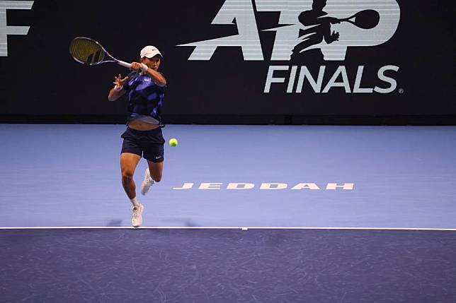 Shang Juncheng of China hits a return during the round robin match against Alex Michelsen of the United States at Next Gen ATP Finals tennis tournament in Jeddah, Saudi Arabia, Dec. 20, 2024. (Xinhua/Luo Chen)