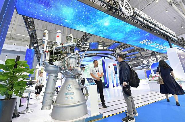 A visitor views an exhibit at the booth of China Aerospace Science and Technology Corporation at the 8th China-Eurasia Expo in Urumqi, northwest China's Xinjiang Uygur Autonomous Region, June 26, 2024. (Xinhua/Wang Fei)