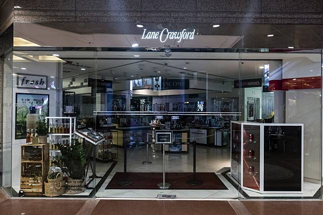 A sign informing customers that the store is closed stands at an entrance to Lane Crawford’s store in Times Square, Causeway Bay, during an anti-government protest at the mall. Photo: Bloomberg