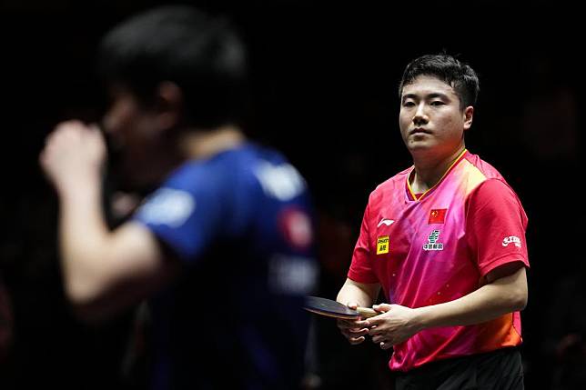 Liang Jingkun &reg; awaits a return from Tomokazu Harimoto during their men's singles round of 16 match at the 2024 World Table Tennis (WTT) Finals in Kitakyushu, Japan, on Nov. 20, 2024. (Xinhua/Zhang Xiaoyu)