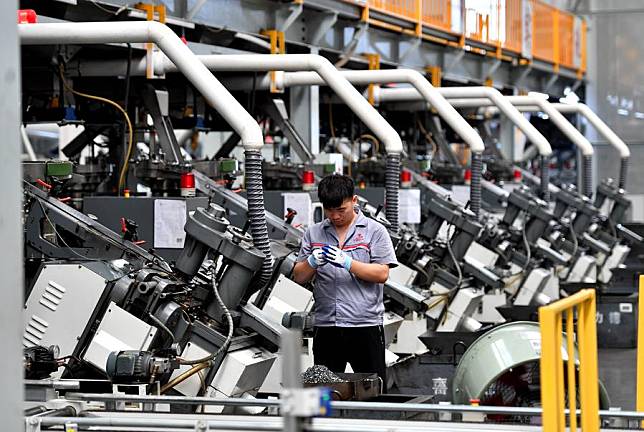 A worker works at an intelligent digital workshop of a fastener manufacturing company in Yongnian District of Handan, north China's Hebei Province, Aug. 16, 2024. (Xinhua/Wang Xiao)