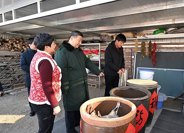 Chinese President Xi Jinping, also general secretary of the Communist Party of China Central Committee and chairman of the Central Military Commission, visits the villagers who have moved into their new houses and inquires about the quality of the reconstructed homes and whether their daily living conditions are adequate, in Zhujiagou Village, Suizhong County of Huludao City, northeast China's Liaoning Province, Jan. 22, 2025. (Xinhua/Li Xueren)