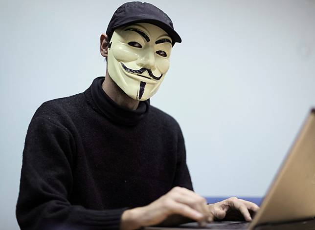 A hacker from Ukrainian hactivist group RUH8 is seen during an interview with Reuters in Kiev